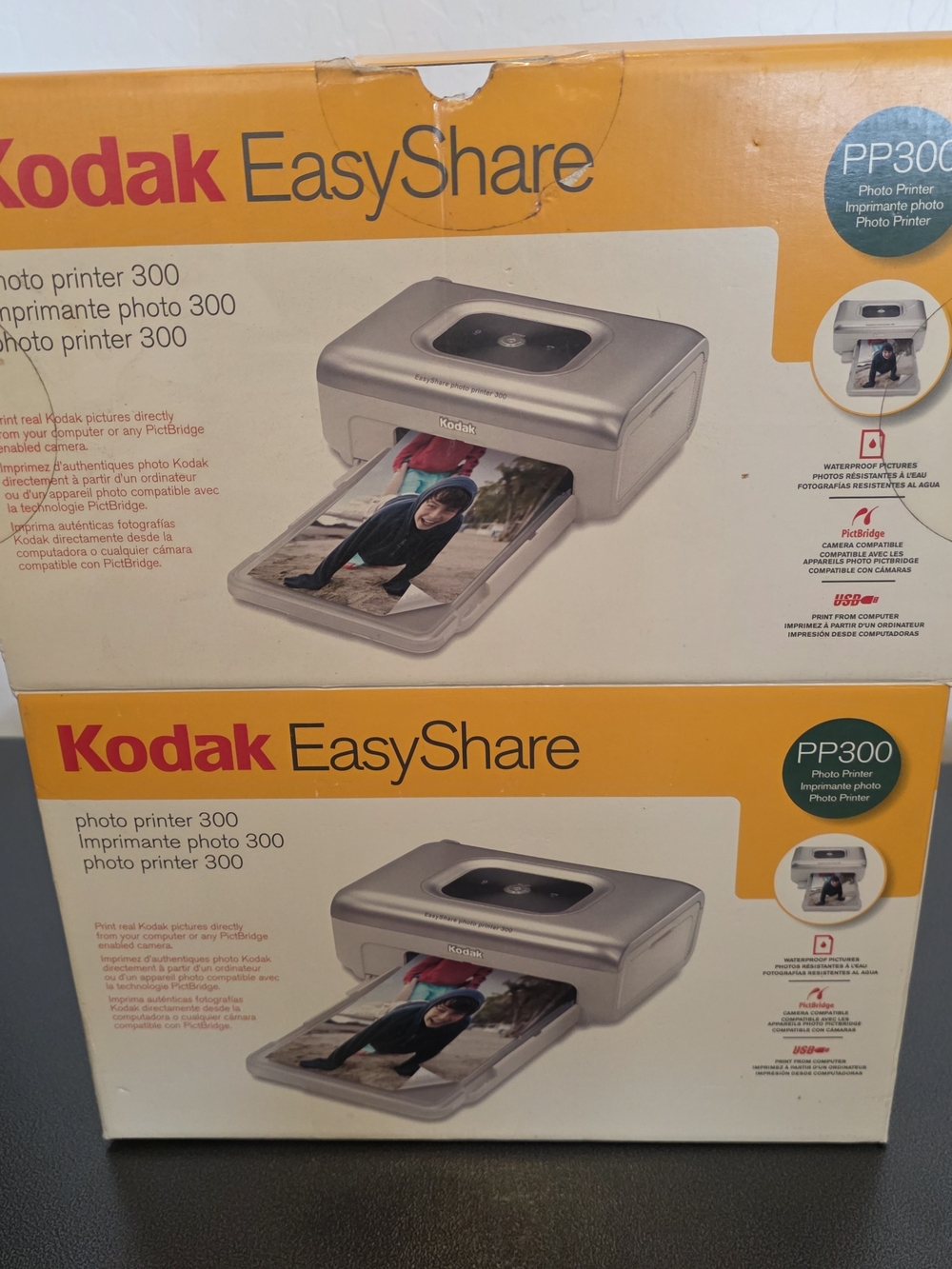 New, Unused Kodak EasyShare PP300 Photo Printer - Yellow/White Box
